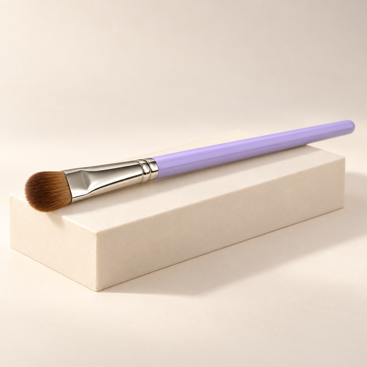 Rounded Shader Brush — three-quarter view on cream pedestal
