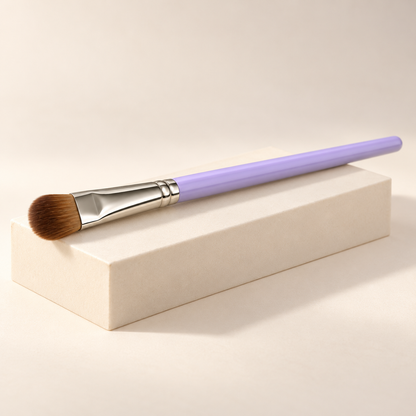 Rounded Shader Brush — three-quarter view on cream pedestal