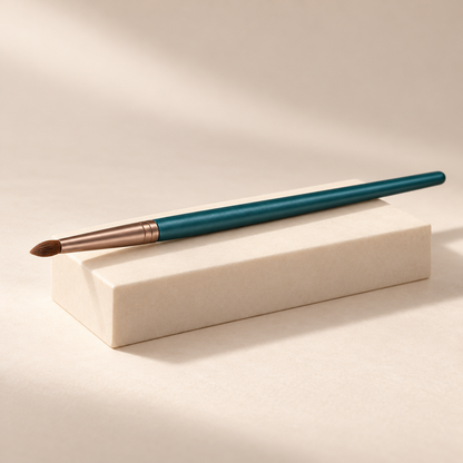 Pencil Detail Brush — three-quarter view on cream pedestal