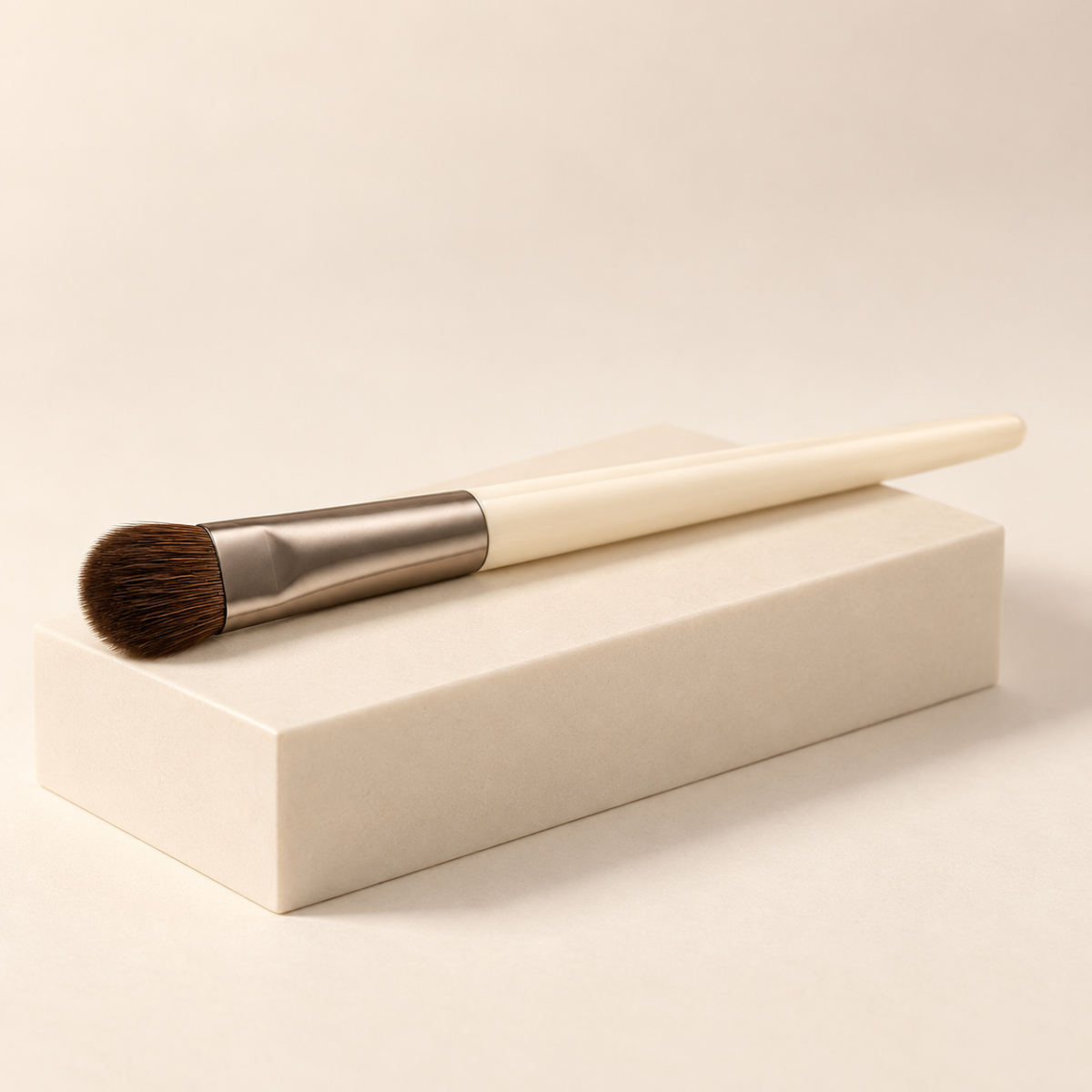 Smudge Brush — three-quarter view on cream pedestal