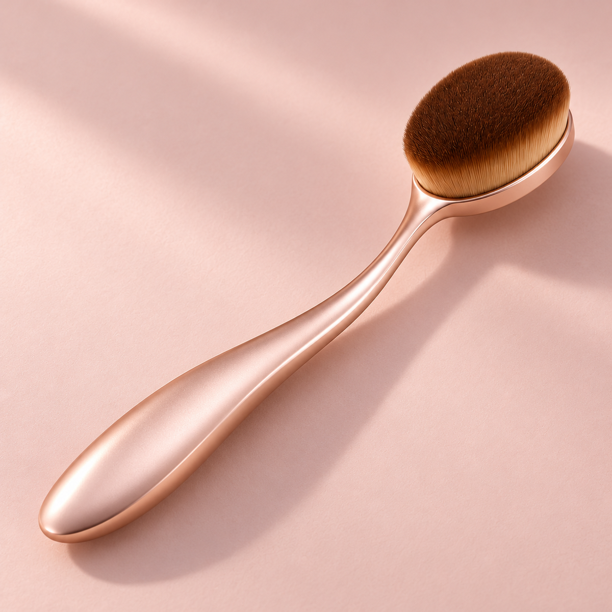 Oval Foundation Brush — diagonal view on pink