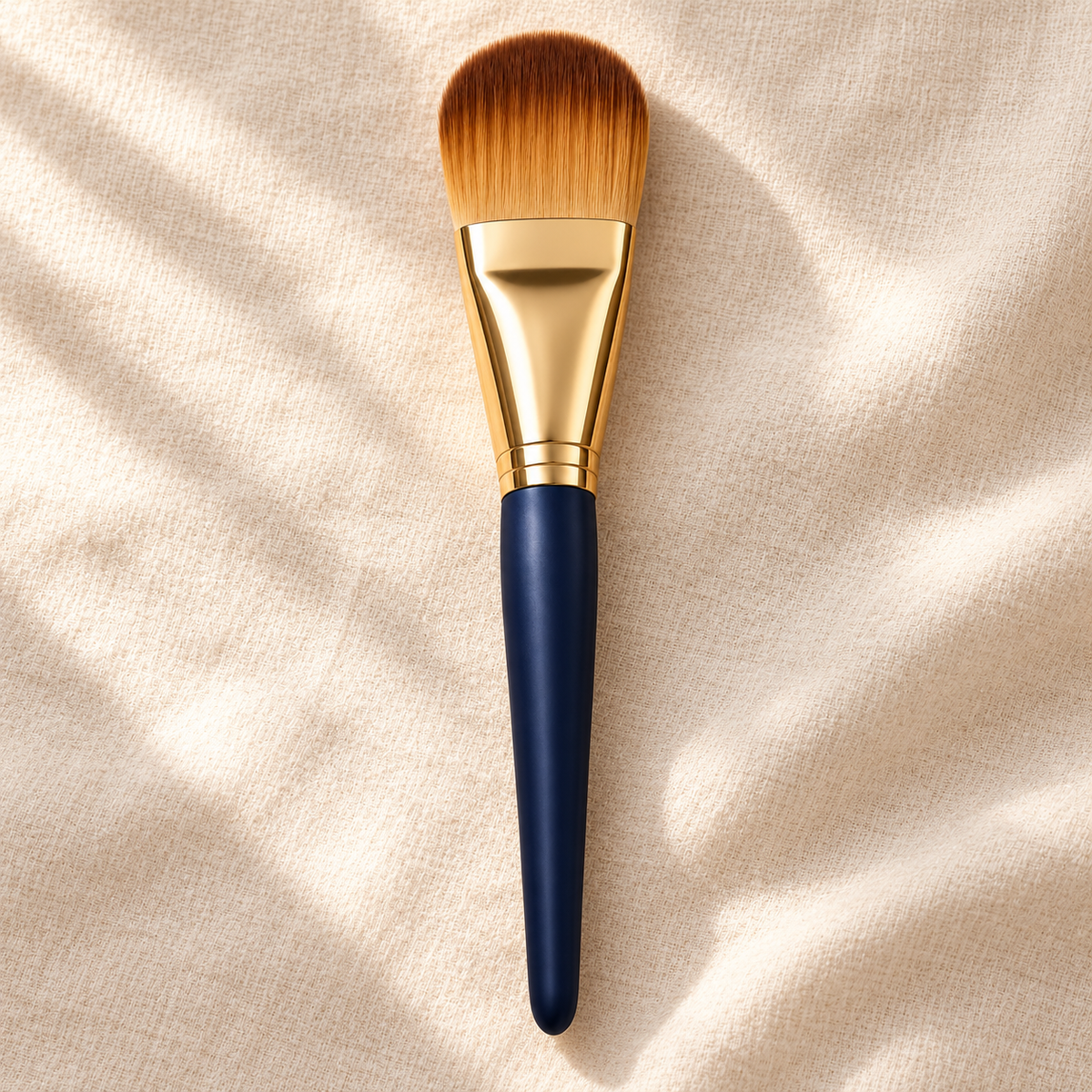 Flat Paddle Foundation Brush — overhead view on ivory linen